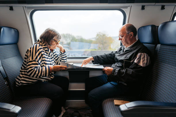 istock Senior Couple Reading A Map While Riding In A Train In Switzerland 1994622079