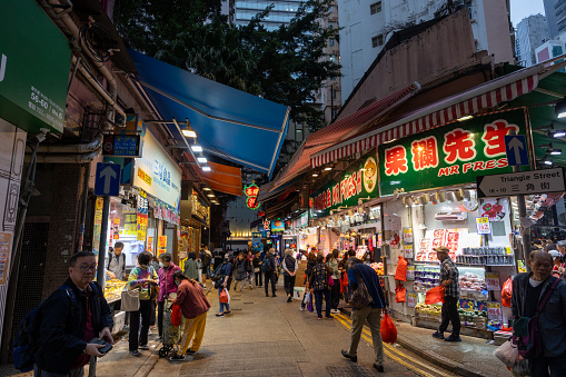 Hong Kong - February 6, 2024 : People at the Triangle Street in Wan Chai, Hong Kong.