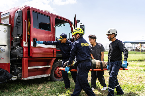 Paramedics carrying accident victim on a stretcher