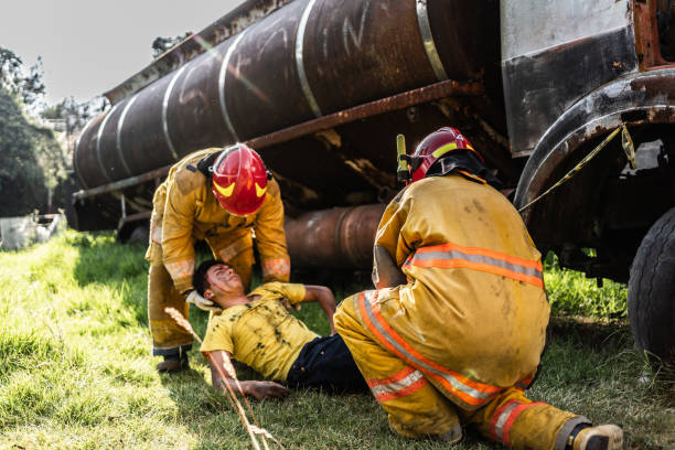 Firefighters helping a car accident victim