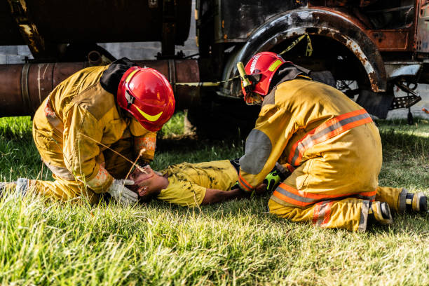 istock Firefighters helping a car accident victim 1994699895