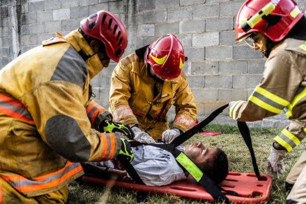 istock Firefighters helping a car accident victim 1994700411