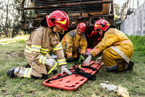 istock Firefighters preparing a stretcher to save accident victim 1994700415