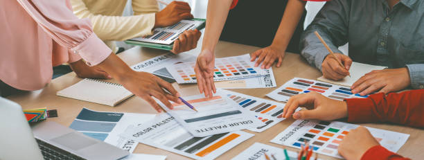 istock Professional architect designer team discuss about color selection. Variegated. 1994710386