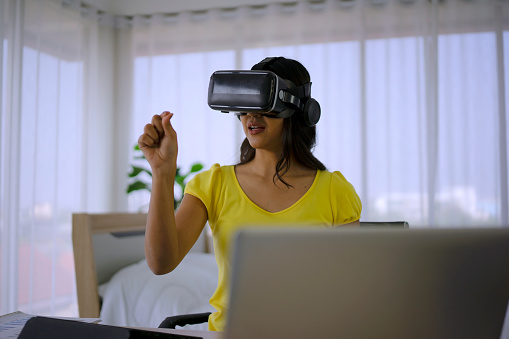Young woman use vr glasses for presentation. Working and Technology.
