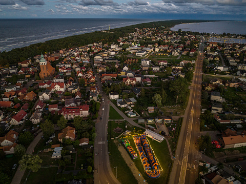Aerial drone view of  Baltic Sea coast in Hel peninsula, Jastarnia. Puck Bay in Poland. Jastarnia city in Poland.  Cloudy sunset in Jastarnia.