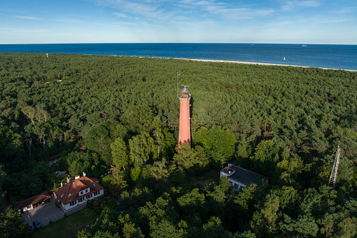 Lighthouse in Hel peninsula. Aerial view of Hel Peninsula in Poland, Baltic Sea and Puck Bay . Hel city. Photo made by drone from above.  End of poland hel peninsula