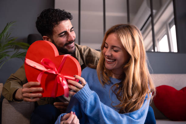 istock Happy young couple with heart shaped gift box. Valentine's Day Celebration 1994767641