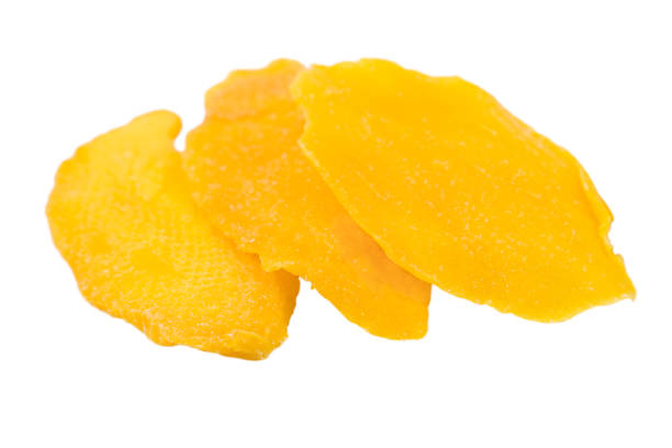 istock Slices of dried mango isolated on white. 1994770367
