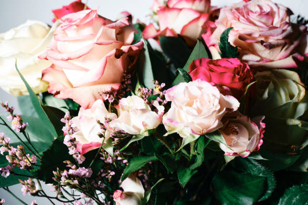 istock Bouquet of roses photographed with direct camera flash. 1994805131