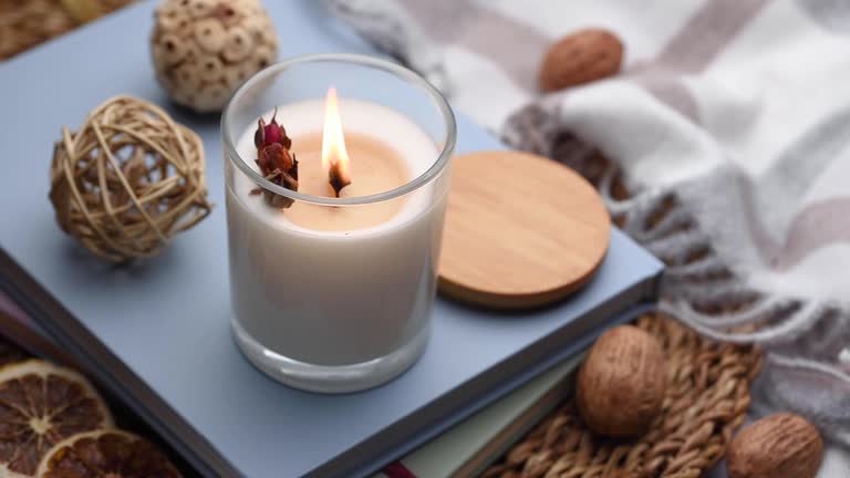 Aromatic candle on the table.  Soy candles  in a jar. Aromatherapy and relax in spa and home. Still life.