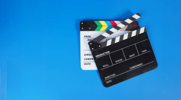 istock Two Clapper board or movie slate on blue background. 1994819269