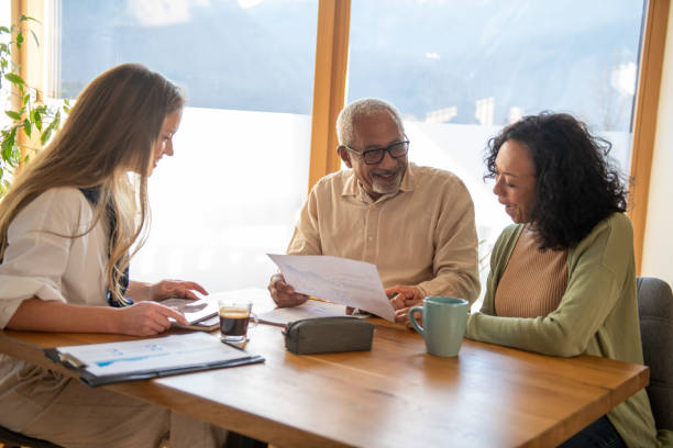 istock Insurance agent at home consultation with elderly people 1994819523