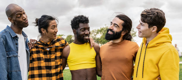 istock group of diverse multiethnic men lined up hugging 1994831737