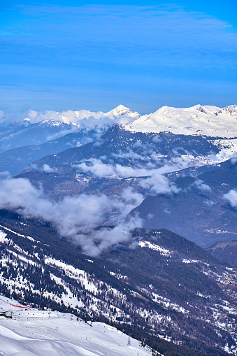 Breathtaking beautiful panoramic view on Snow Alps - snow-capped winter mountain peaks around French Alps mountains, The Three Valleys: Courchevel, Val Thorens, Meribel (Les Trois Vallees), France.