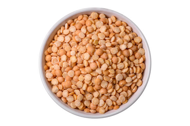 istock Dried pea grains, divided into halves, are yellow in color when raw 1994835444