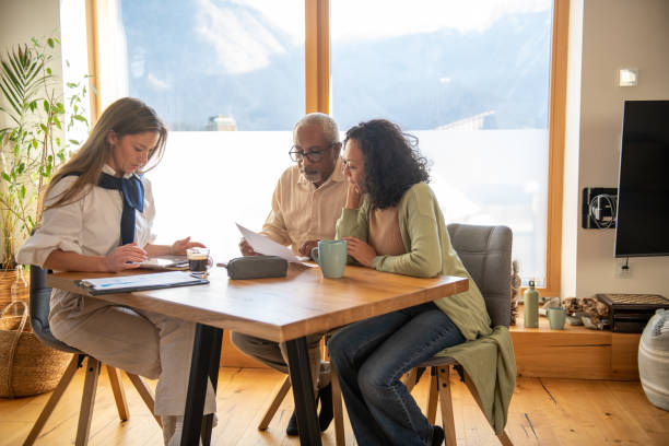 istock Insurance agent at home consultation with elderly people 1994839740