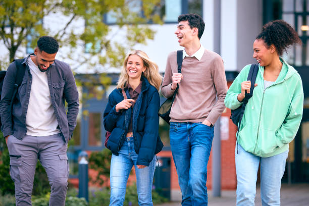 istock Group Of University Students Outdoors Walking Past College Buildings 1994862603