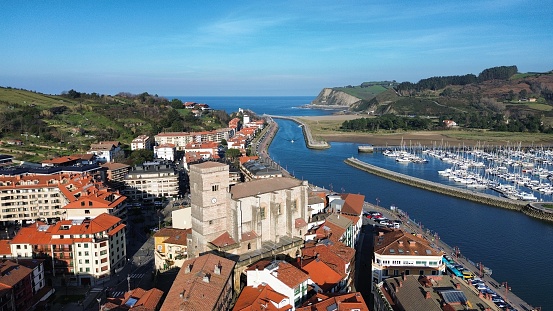Zumaia town with the parish of San Pedro Apostol, the estuary, the marina and the Cantabrian Sea in the background