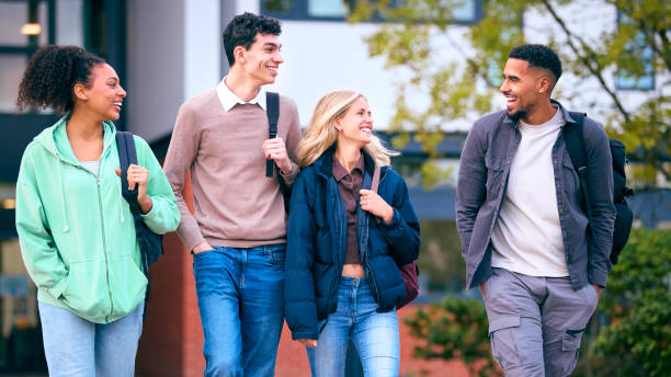 istock Group Of University Students Outdoors Walking Past College Buildings 1994870137