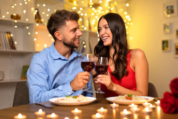 istock Couple toasting wine on a romantic dinner 1994894138
