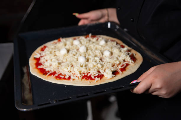 istock Homemade Pizza Ready for Oven Baking 1994899503
