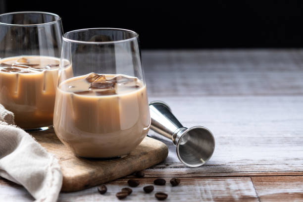 istock Traditional Irish cream coffee liqueur with ice on wooden table 1994901631