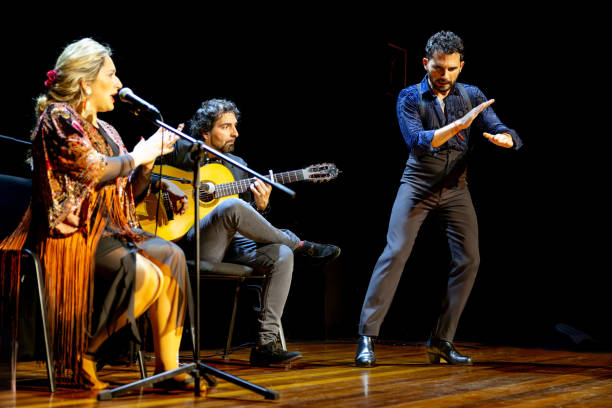 istock Passionate flamenco dancer with live musicians on stage, copy space. 1994905852