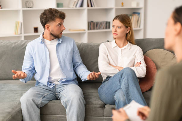 istock couple having quarrel discussing their marital problems with counselor indoors 1994911853