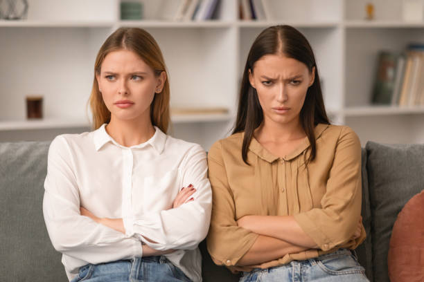 istock Two ladies angry after conflict sitting on sofa at home 1994912452