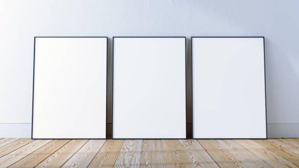 istock 3 frames mockup scene on white wall and hardwood floor, 3d render. 1994931105