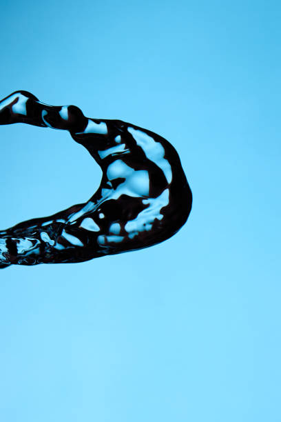 Splash Of Water Over Blue Background