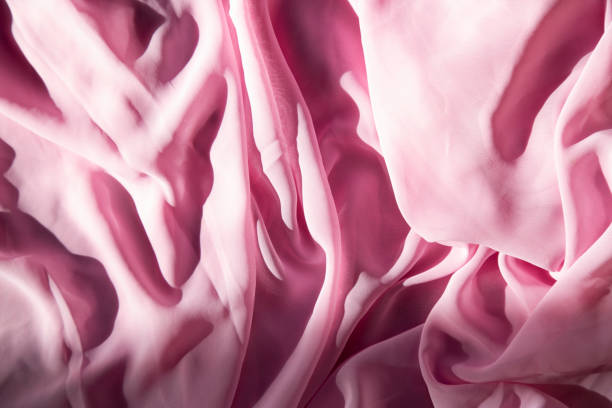 istock Sensual pink drapery pink satin for luxurious backdrops 1994955848