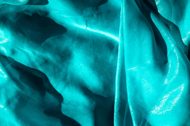 istock Azure Calm - gentle Folds in Teal Fabric background 1994956385