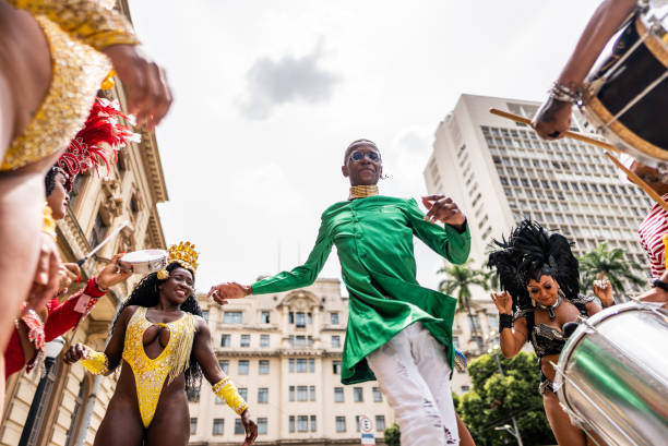 istock Young man dancing at a street carnival party 1994960370