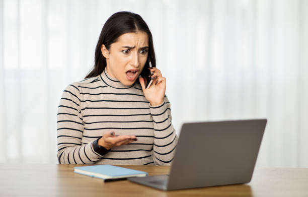istock Distressed young woman at home, expressing frustration and confusion 1994971218