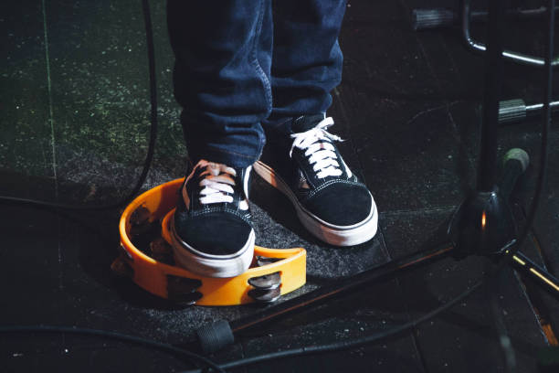 istock Musician plays the tambourine. 1994979325