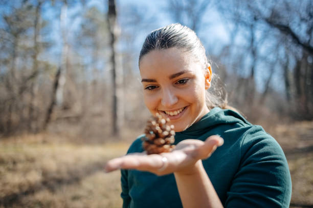 Young woman living healthy lifestyle enjoying fresh air and feeling connection with nature