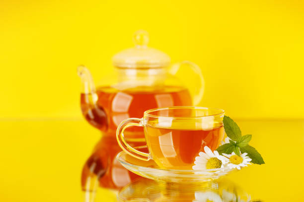 Soothing herbal tea blend with mint and chamomile. On yellow background