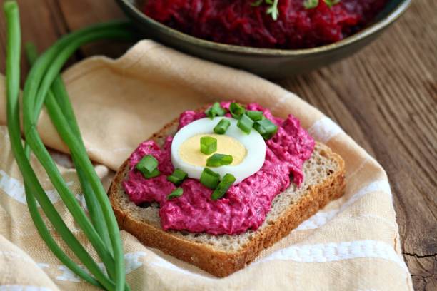 Beetroot mixed with goat cream cheese spreaded on whole grain bread.