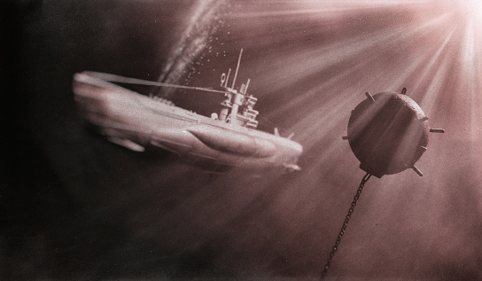 A World War II era U-Boat submarine navigating the depths of an ocean, passing perilously close to an old-fashioned contact sea mine.