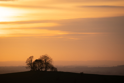 The sun sets on the Chiltern Hills, Buckinghamshire, in the South East of England.