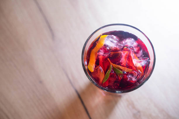 istock glass with fresh spring or summer iced drink mocktail with lemon and mint at table in caffe in evening light 1995034005
