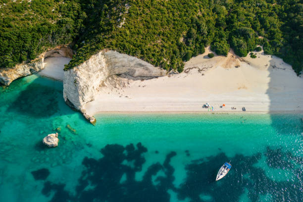 A beautiful lagoon of Fteri, beach, Kefalonia, Greece Beautiful lagoon of Fteri beach on Kefalonia, Greece. One sailboat anchored in the lagoon, and the sea is crystal clear, blue and turquoise. kefalonia stock pictures, royalty-free photos & images