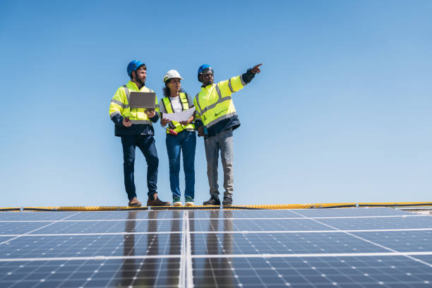 istock Service engineer checking solar cell on the roof for maintenance if there is a damaged part. Engineer worker install solar panel. Clean energy concept. 1995089617