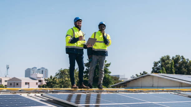 istock Service engineer checking solar cell on the roof for maintenance if there is a damaged part. Engineer worker install solar panel. Clean energy concept. 1995092405