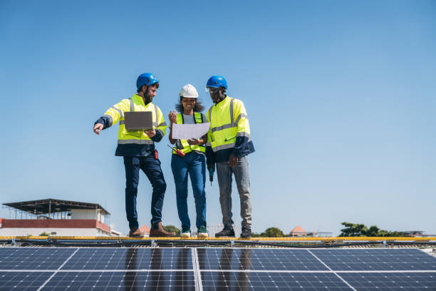 istock Service engineer checking solar cell on the roof for maintenance if there is a damaged part. Engineer worker install solar panel. Clean energy concept. 1995094637