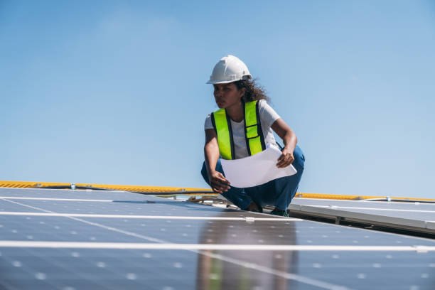 istock Service engineer checking solar cell on the roof for maintenance if there is a damaged part. Engineer worker install solar panel. Clean energy concept. 1995097425