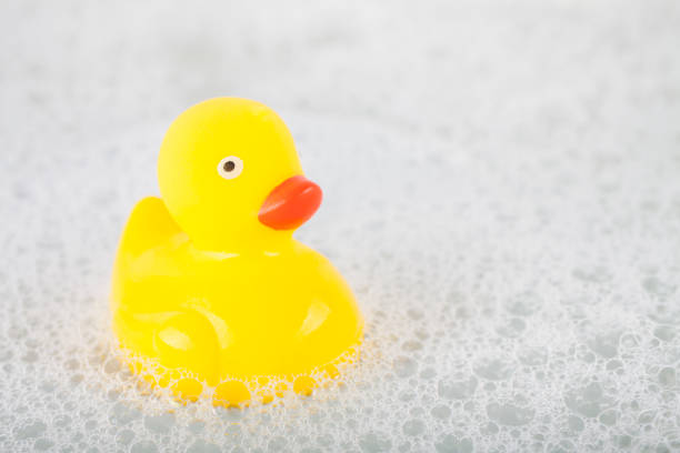 istock Yellow rubber duck toy floating in water 1995100836