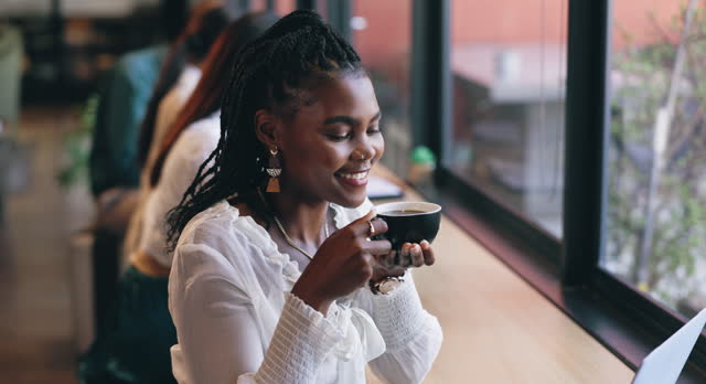 Coffee shop, relax and black woman by window with drink for happiness, calm and breakfast in cafe. Restaurant, weekend and happy person with mug, aroma and scent for latte, caffeine and cappuccino